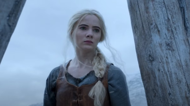 Freya Allen as Ciri standing in a snowy area in The Witcher