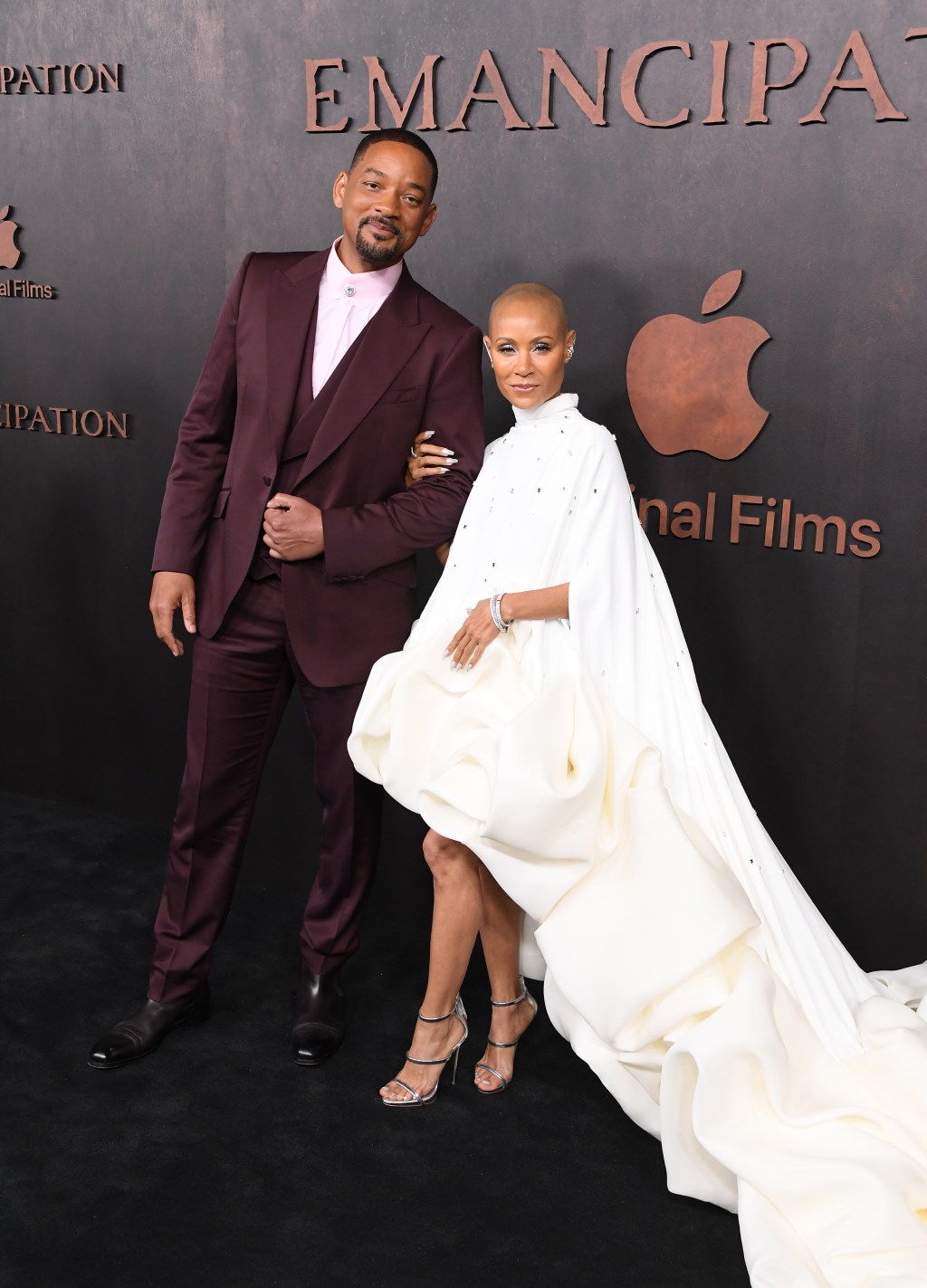 Will Smith and Jada Pinkett Smith posing on a red carpet with