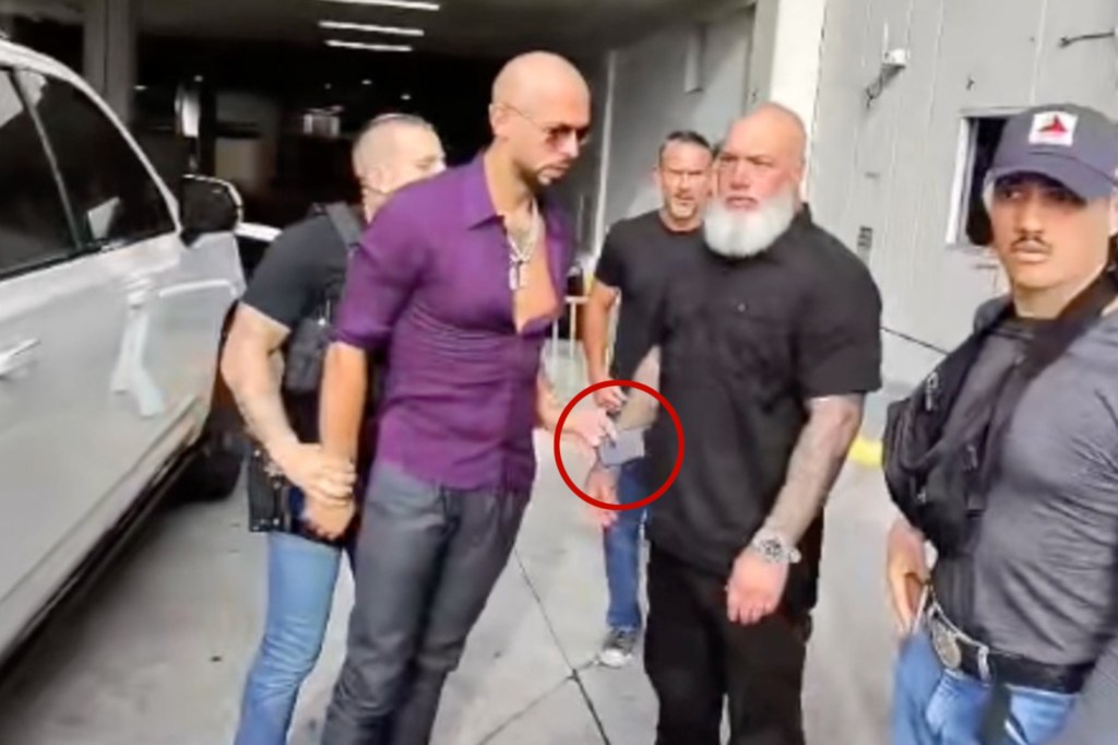Andrew Tate arrest video shows moment he tried to give phone to bodyguard as he’s cuffed by US Marshals