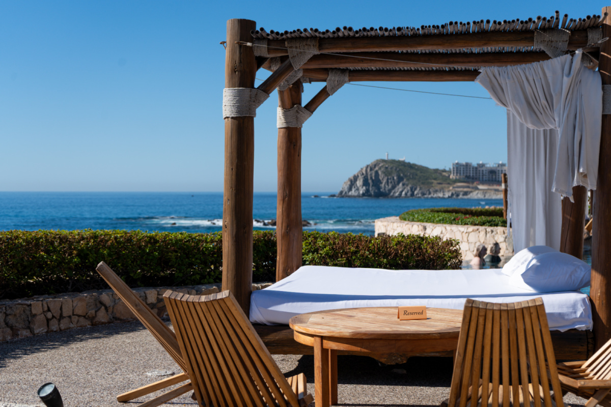 Bali Bed Cabana with reserved sign on the table in Los Cabos