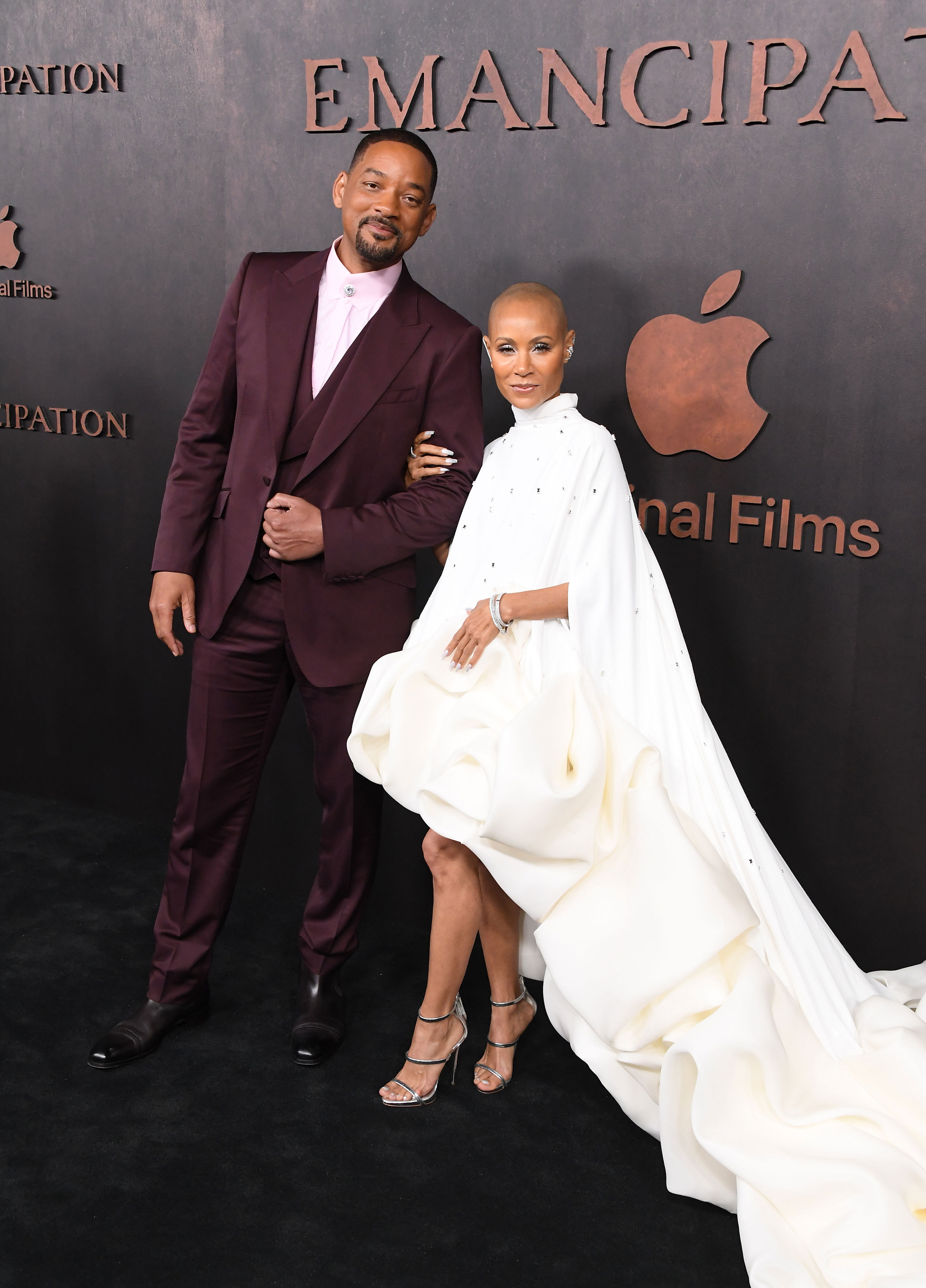 Will Smith and Jada Pinkett Smith posing on a red carpet with 