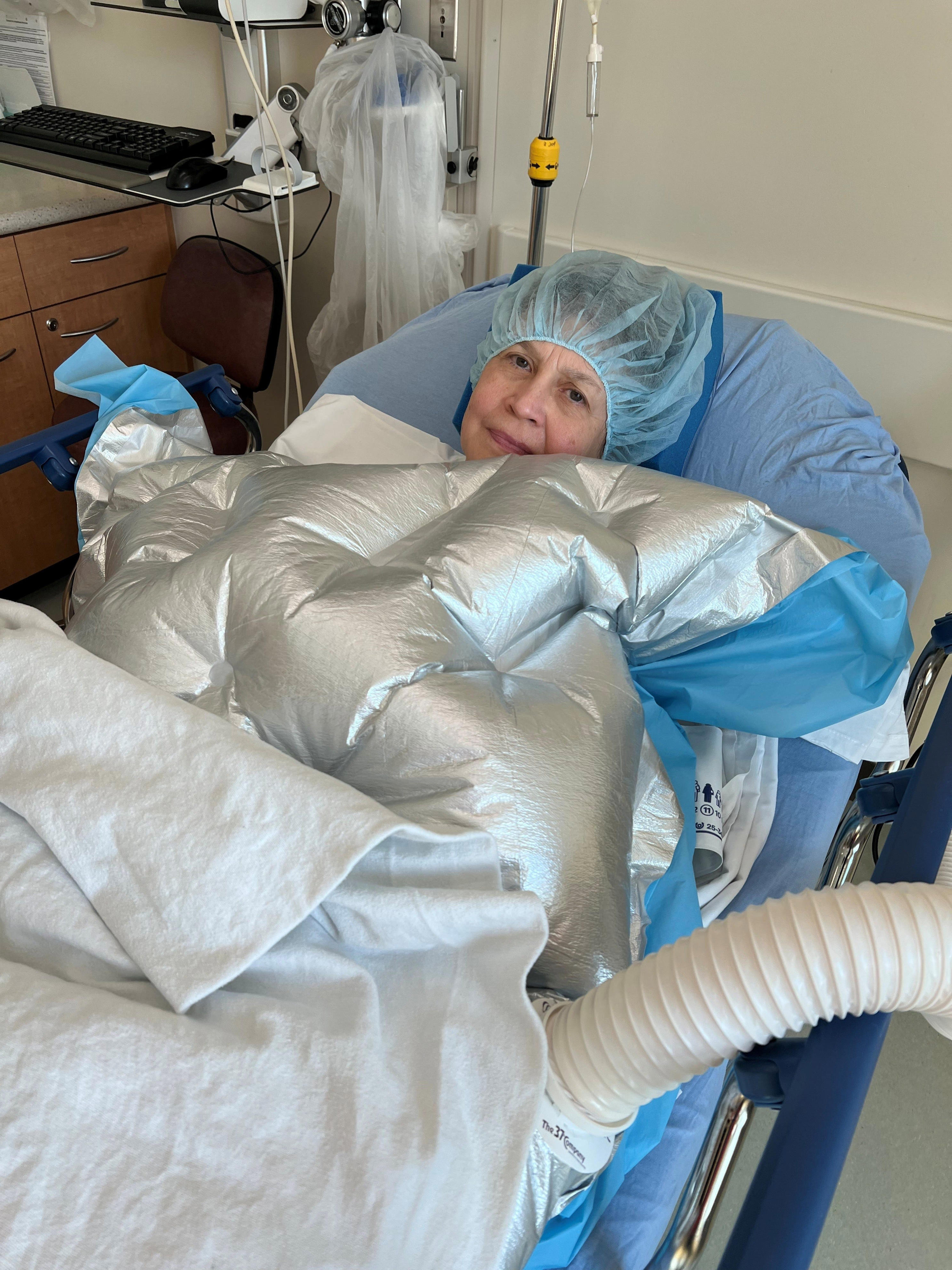 A warming blanket helps First Coast News anchor Jeannie Blaylock prepare for breast reconstruction surgery at the Baptist South hospital in Jacksonville.