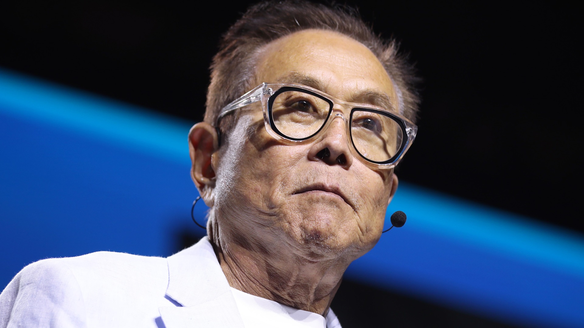 DISCOVER Robert Kiyosaki at 2024 FreedomFest in Las Vegas, Nevada, with a head mounted microphone
