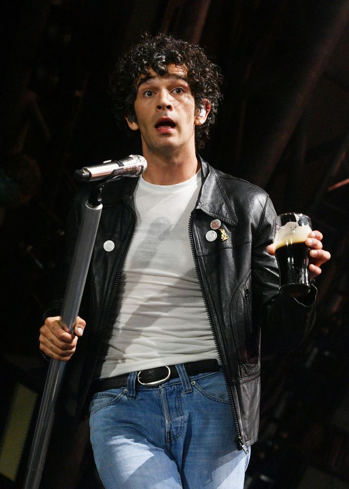 Matty Healy singing on stage
