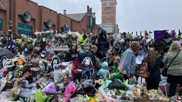 Fans' floral tributes took over Black Sabbath Bench on Broad Street following his death