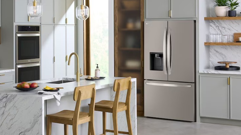 A modern kitchen with built-in stainless steel appliances