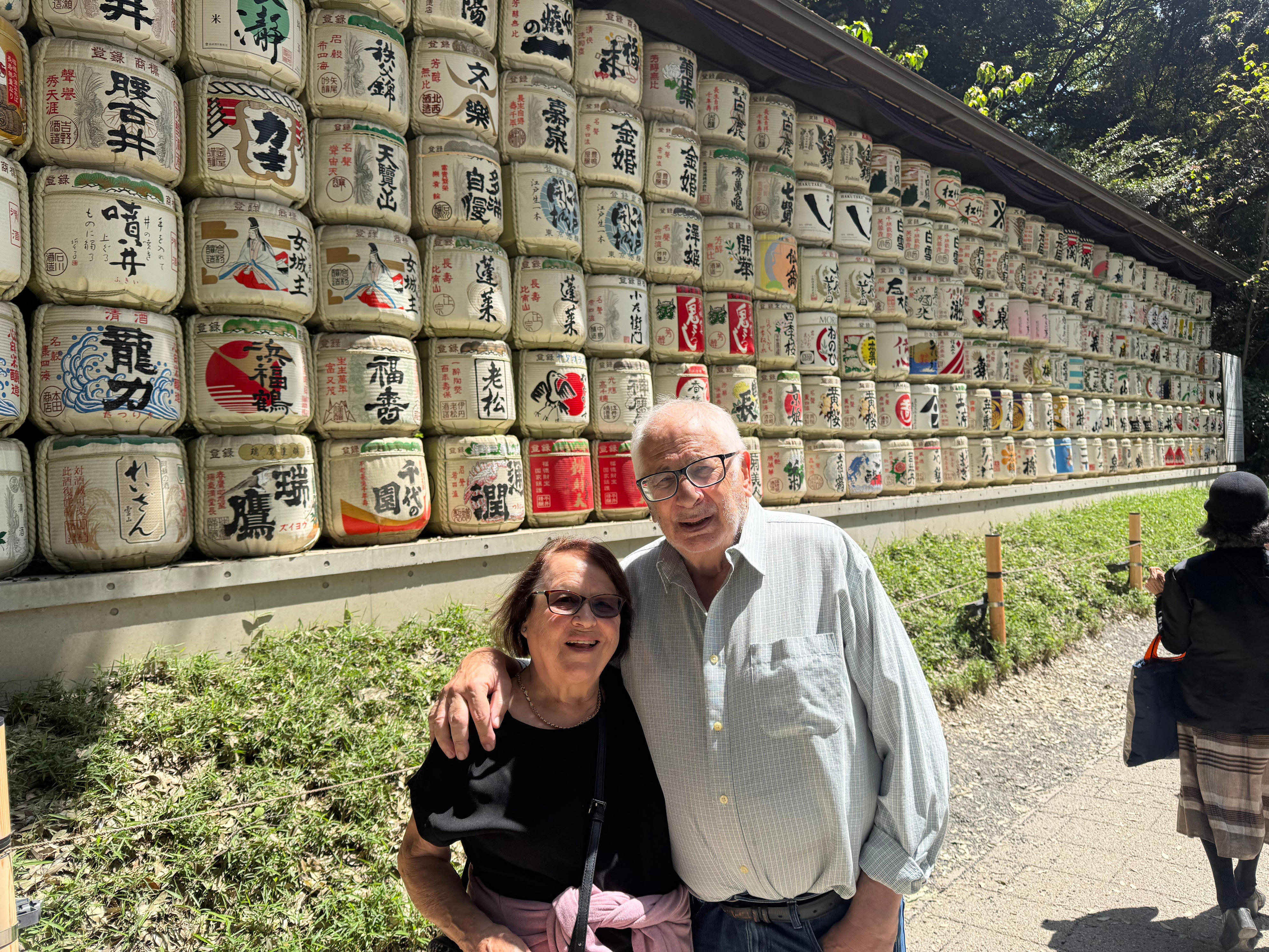 Older couple posing outside of a temple in Japan