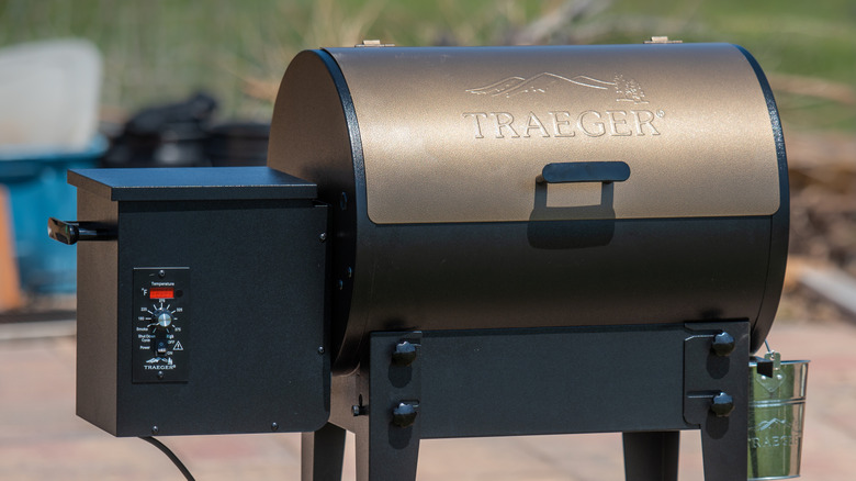 A drum-shaped Traeger pellet grill