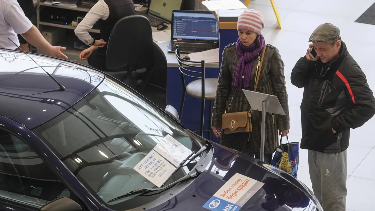 customers show cars in a dealership