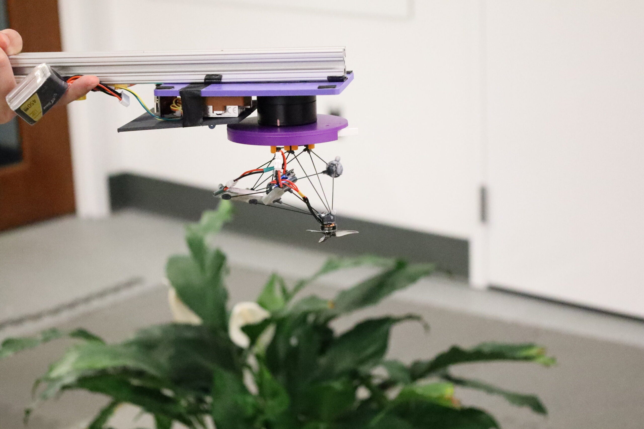Components are spread around the drone — at different heights and different angles with lots of space in between — to prevent them from visually overlapping when spinning. So, when everything blurs together, the drone becomes a faint, semi-transparent cloud rather than a distinct shape. (CREDIT: Northwestern University