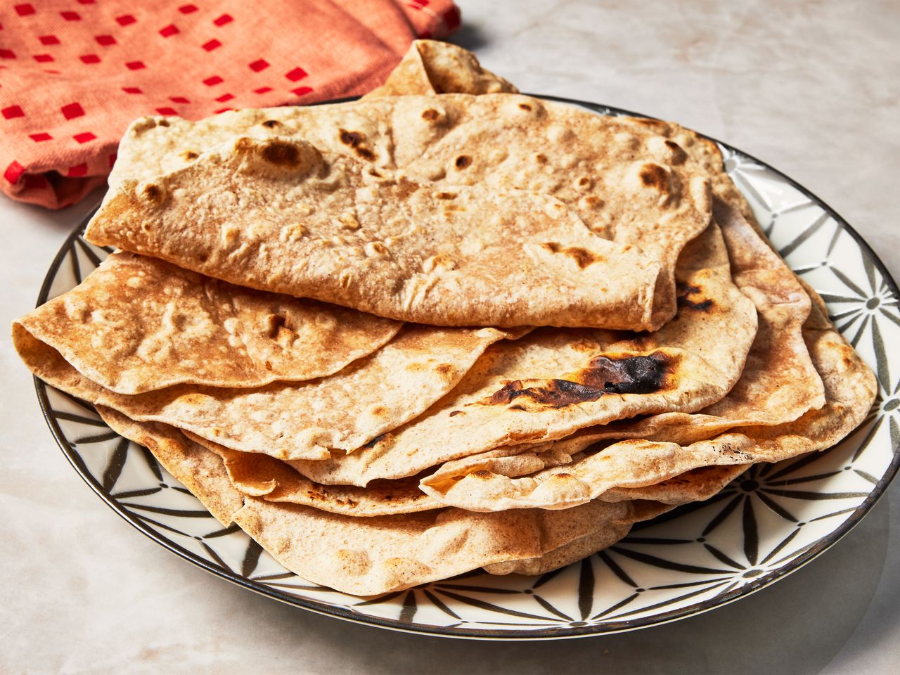 Indian Chapati bread stacked on a plate
