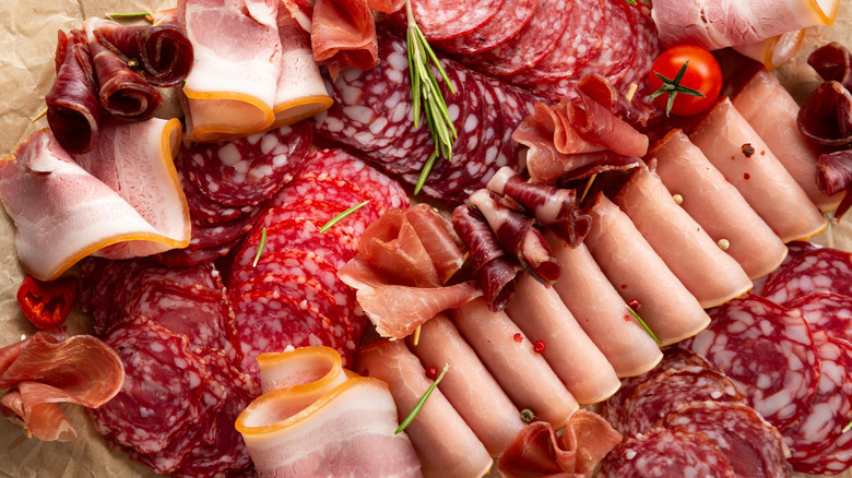 Overhead view of charcuterie board with cold cuts and deli meat