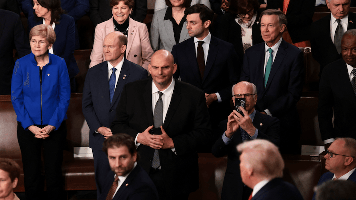U.S. Senator Elizabeth Warren (D-MA), U.S. Senator Chris Coons (D-DE) and U.S. Senator John Fetterman (D-PA) attend U.S. President Donald Trump's State of the Union address to a joint session of Congress in the House Chamber at the U.S. Capitol in Washington, D.C., U.S., February 24, 2026. REUTERS/Evelyn Hockstein