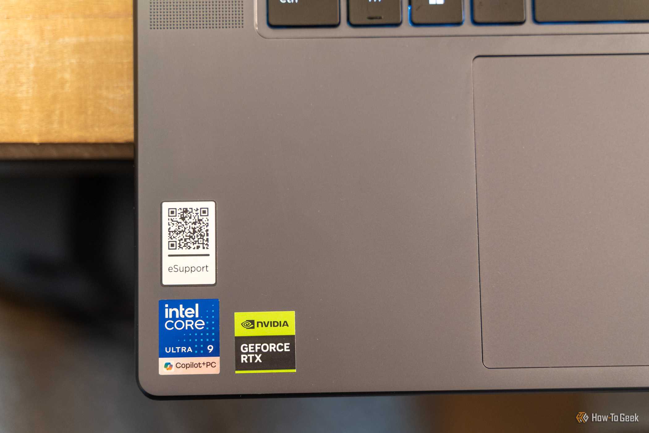 Lenovo Yoga Pro 9i Aura Edition Gen 11 palm rest with Intel Core Ultra 9 and NVIDIA GeForce RTX stickers.