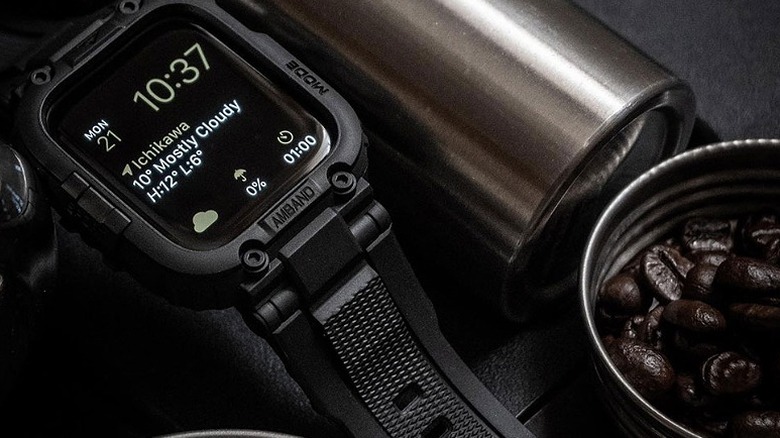 Smartwatch with a sporty band and case showing weather conditions and time.