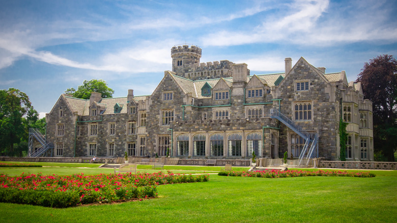 View of Historic Long Island Gold Coast mansion Hempstead House at Sands Point Preserve with garden in foreground