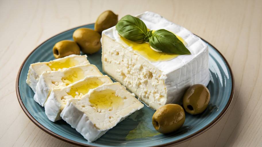 Block of feta cheese with olives
