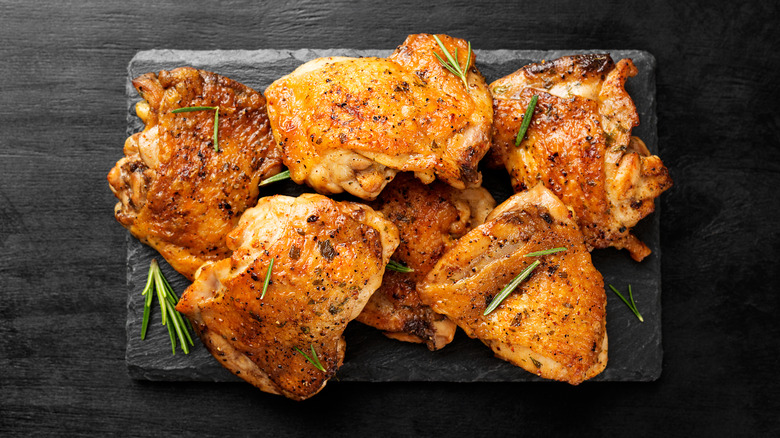 Cooked chicken thighs with rosemary