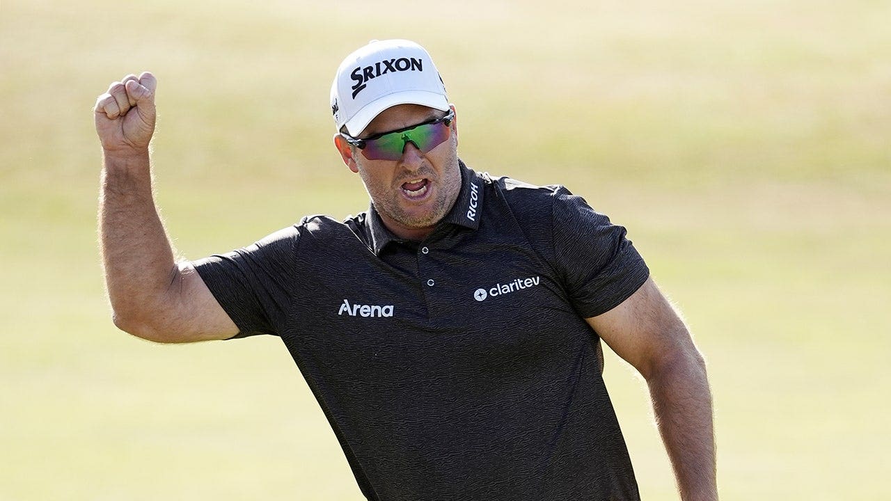 Ryan Fox celebrates after making birdie on 18 to win The 154th Open Championship at Royal Birkdale.