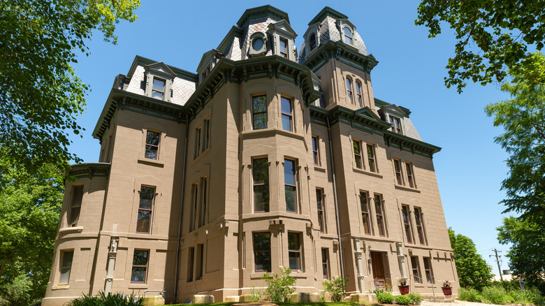 Hegeler Carus Mansion tall and imposing against blue sky framed by trees LaSalle Illinois