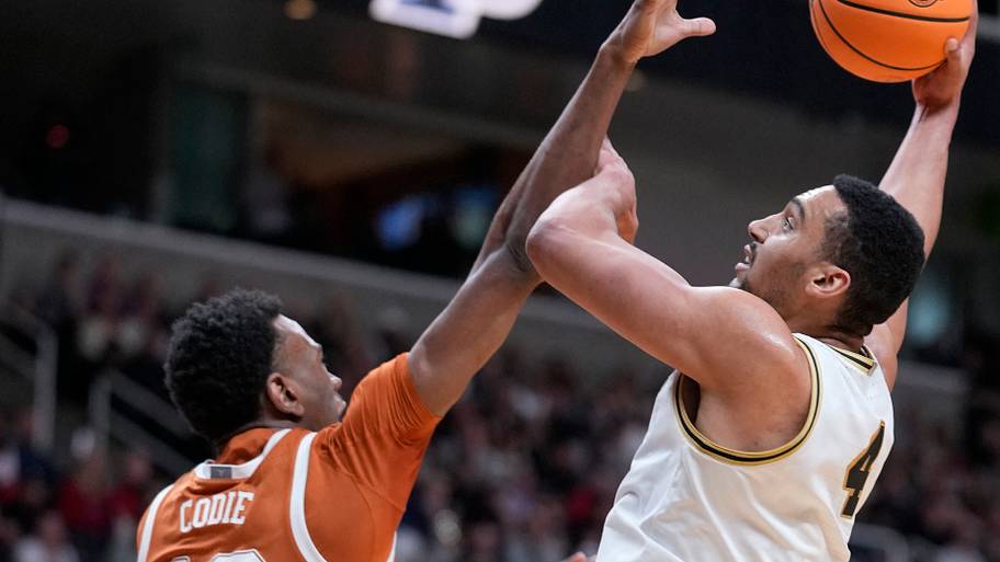 Purdue Boilermakers forward Trey Kaufman-Renn (4) shoots over a Texas player.