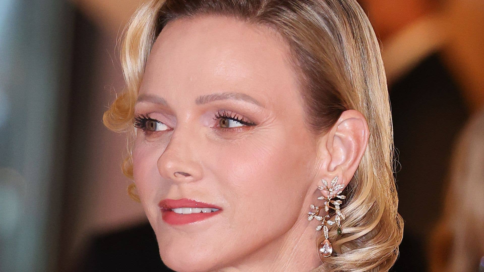 Princess Charlene debuts hair transformation in figure-hugging dress of dreams and £40.5k earrings