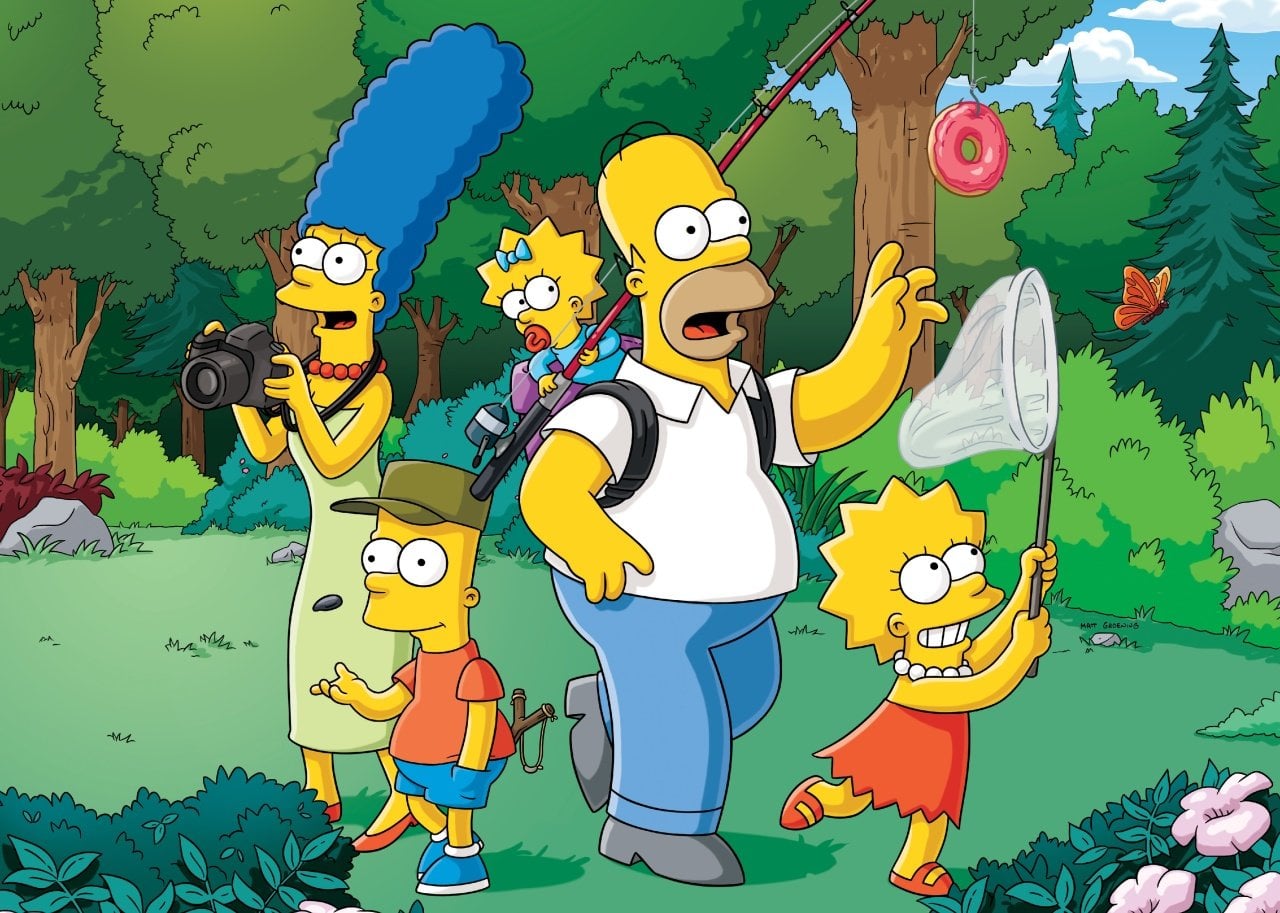 The Simpsons out in nature with baby Maggie holding a fishing pole dangling a donut in front of Homer and Lisa catching butterflies with a net.