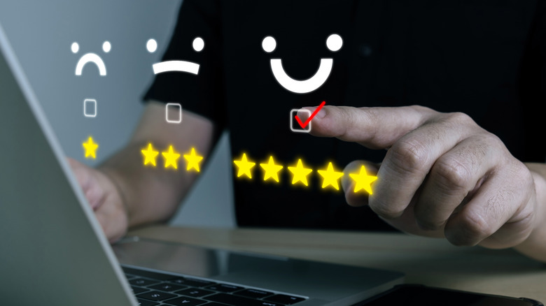 Holographic image of emojis and user ratings.