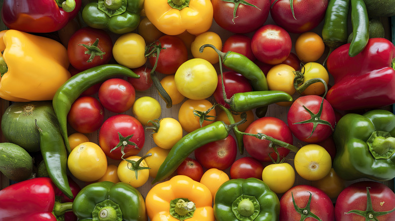 Overhead view of assorted tomatoes and peppers