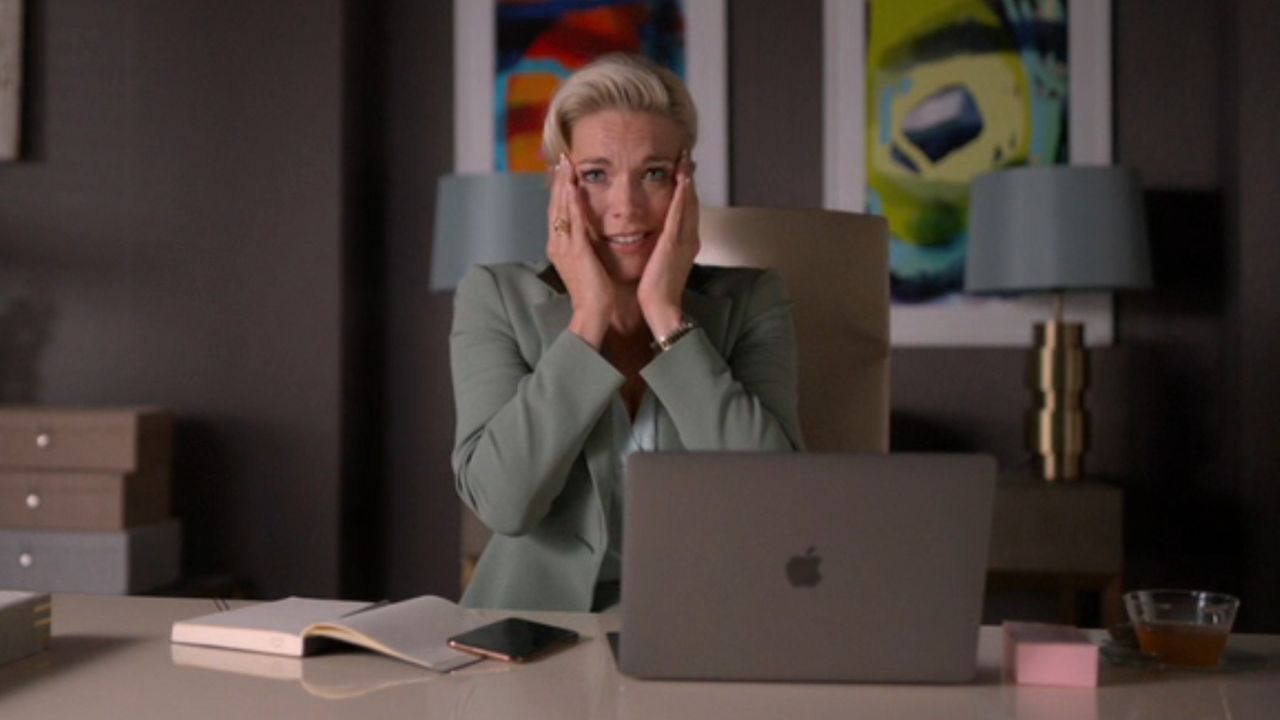 Hannah Waddingham holding both her hands up to her face and looking shocked on Ted Lasso.