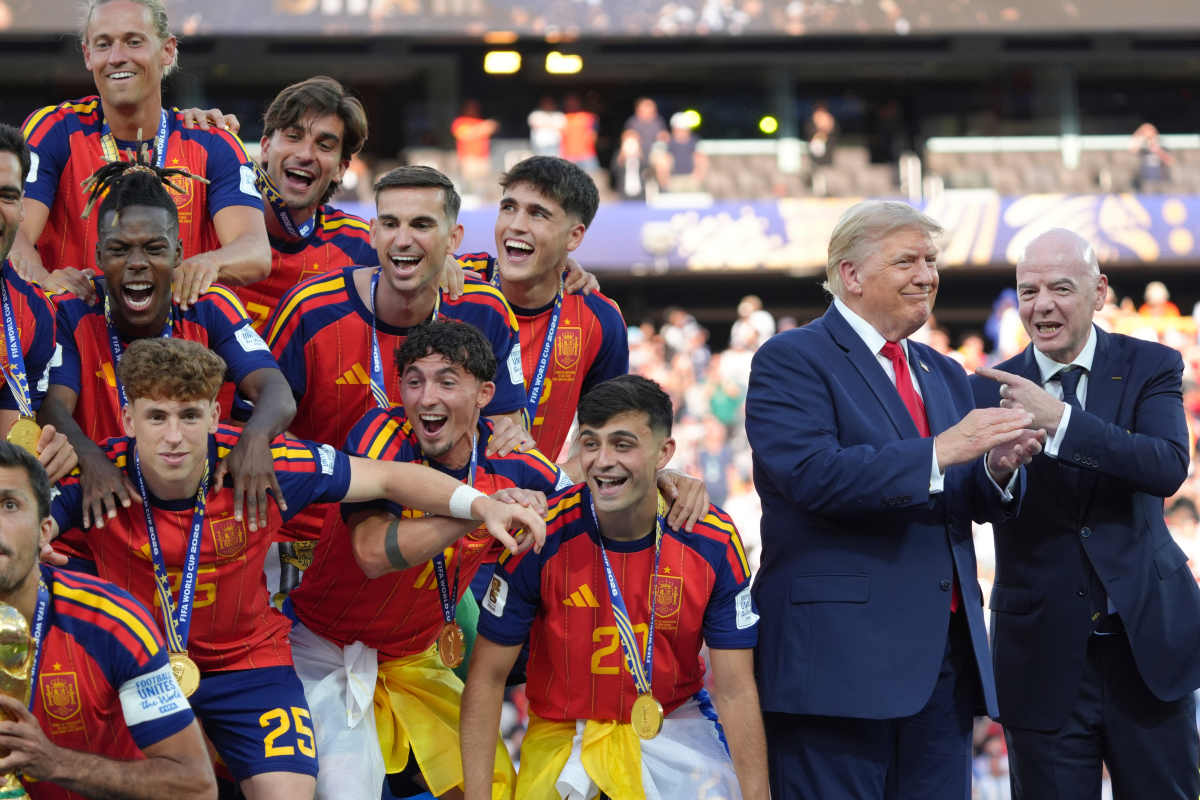 Spain players, from left, cheer alongside President Donald Trump and FIFA President Gianni Infantino at the conclusion of the World Cup championship final soccer match between Spain and Argentina in East Rutherford, N.J., Sunday, July 19, 2026. (AP Photo/Jacquelyn Martin)
