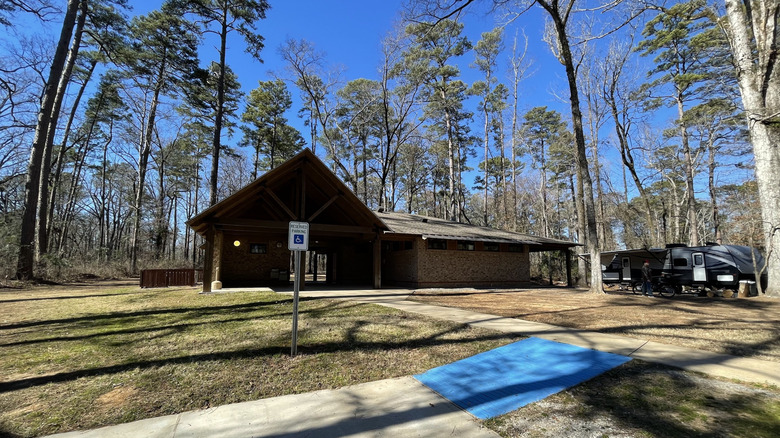 Cabin among pine trees at Chemin-A-Haut State Park in Louisiana