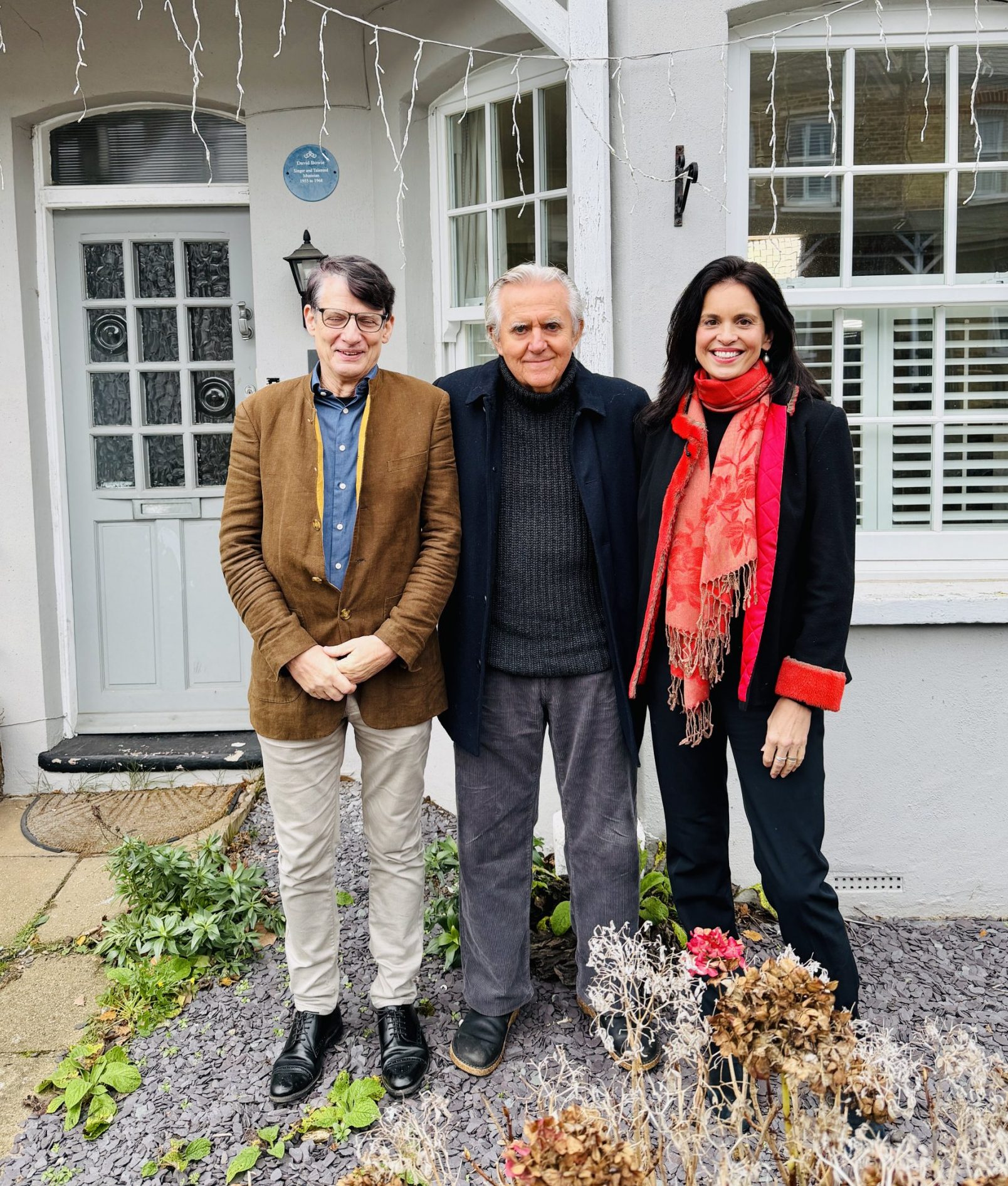 Curator Geoffrey Marsh, David Bowie's lifelong friend George Underwood, and Dr Nicola Stacey, from the Heritage of London Trust, outside Bowie's home in Plaistow Grove, Bromley