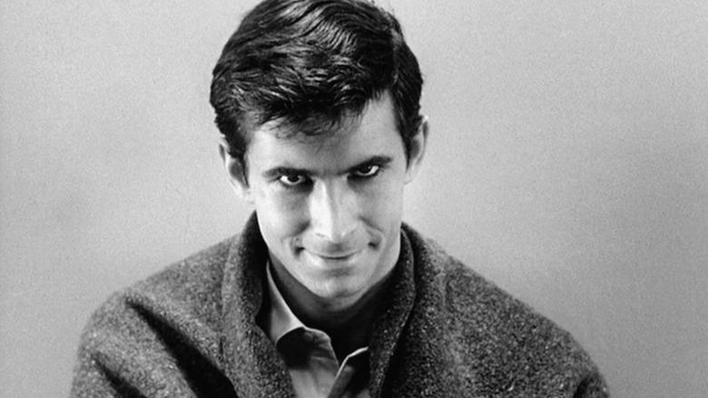 Norman Bates looking up and smiling