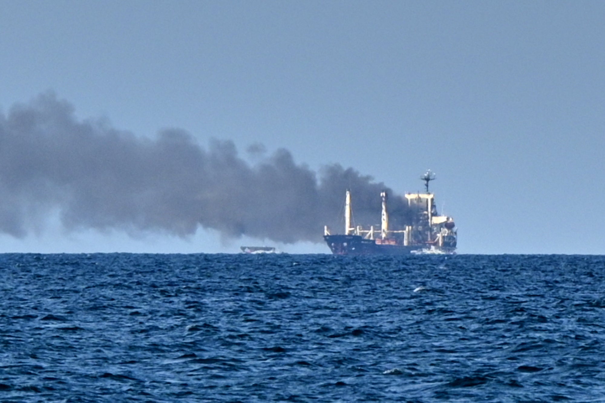 Smoke rises from the grain carrier Golden Leo under the Guinea-Bissau flag after Russian missile strike in the Black Sea close to Odesa, Ukraine (AP)