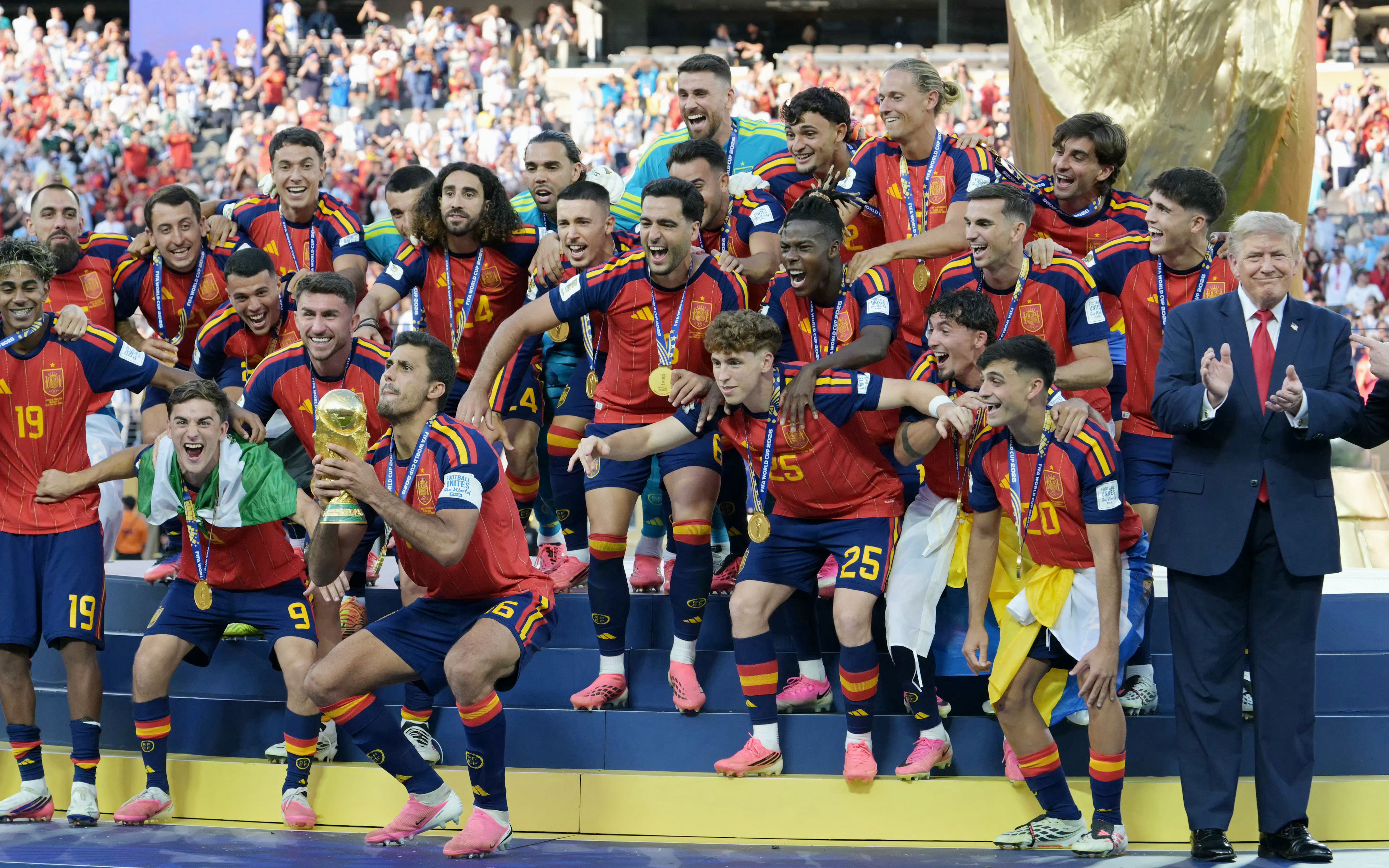 Donald Trump lingered awkwardly on stage as Spain lifted the World Cup trophy (AFP/Getty)