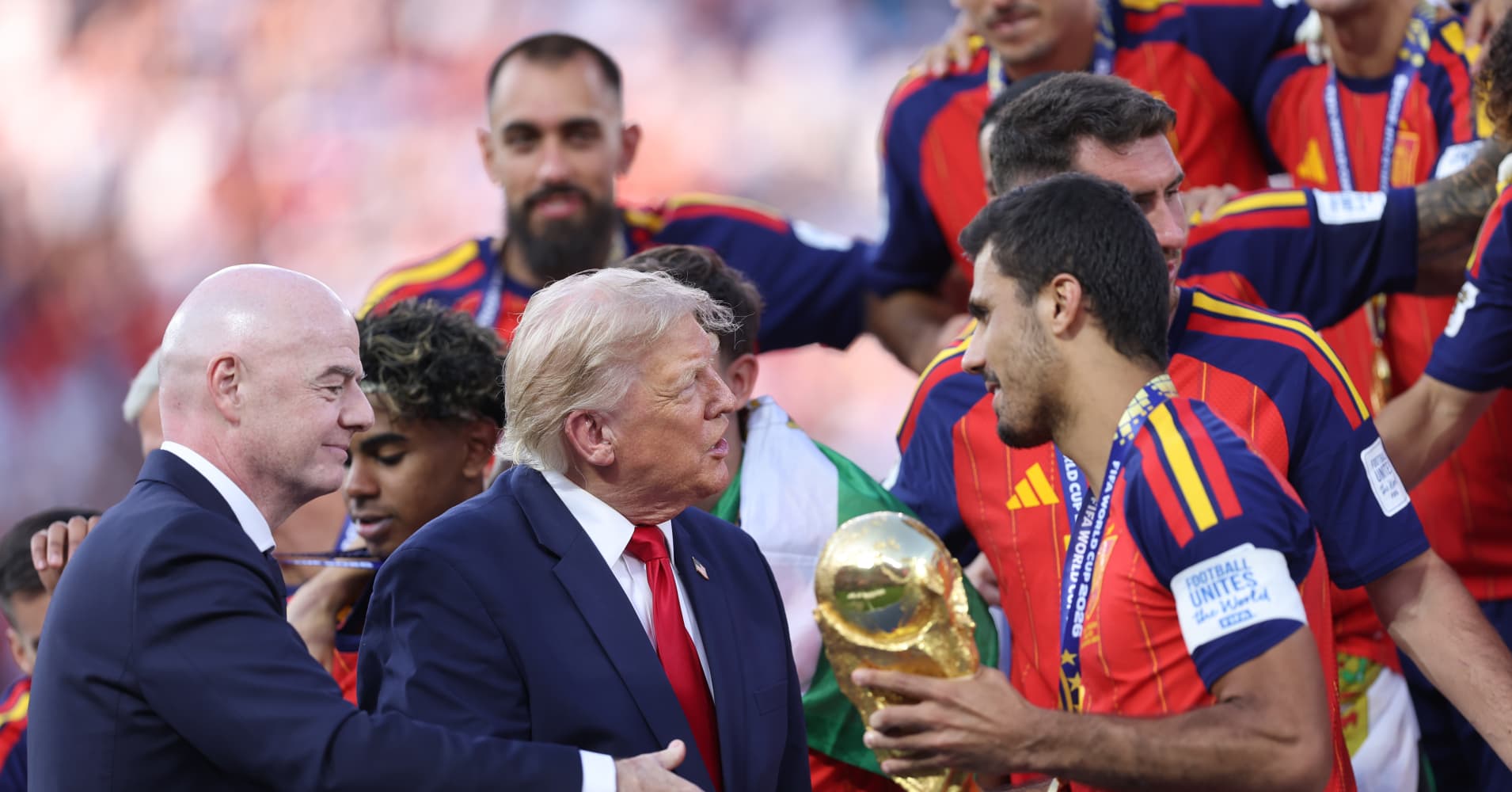 Infantino with Trump presenting the FIFA World Cup trophy to Rodri.