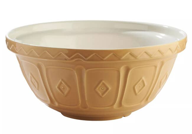 Ceramic mixing bowl with embossed geometric patterns on the exterior, ideal for kitchen use