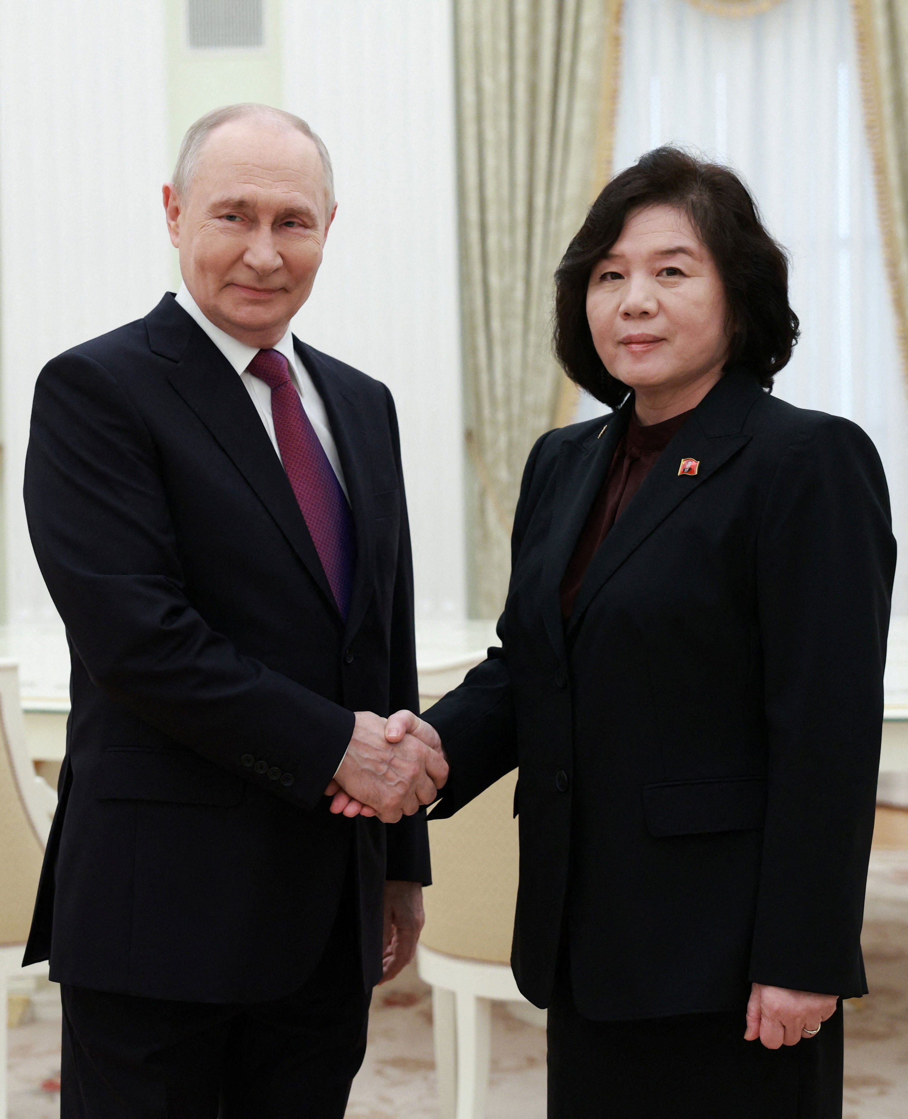 Vladimir Putin shakes hands with North Korean foreign minister Choe Son Hui during a meeting at the Kremlin in Moscow (Reuters)