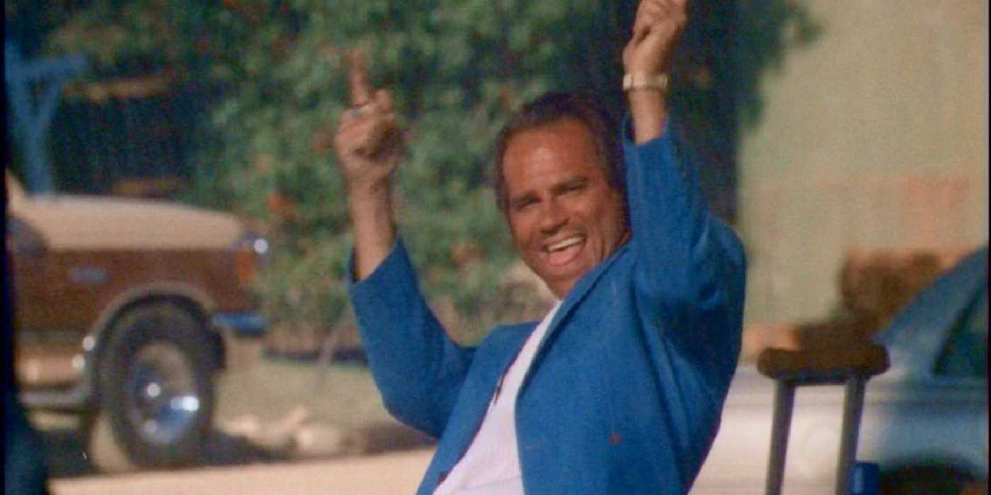 The Rain King with his hands in the air in X-Files