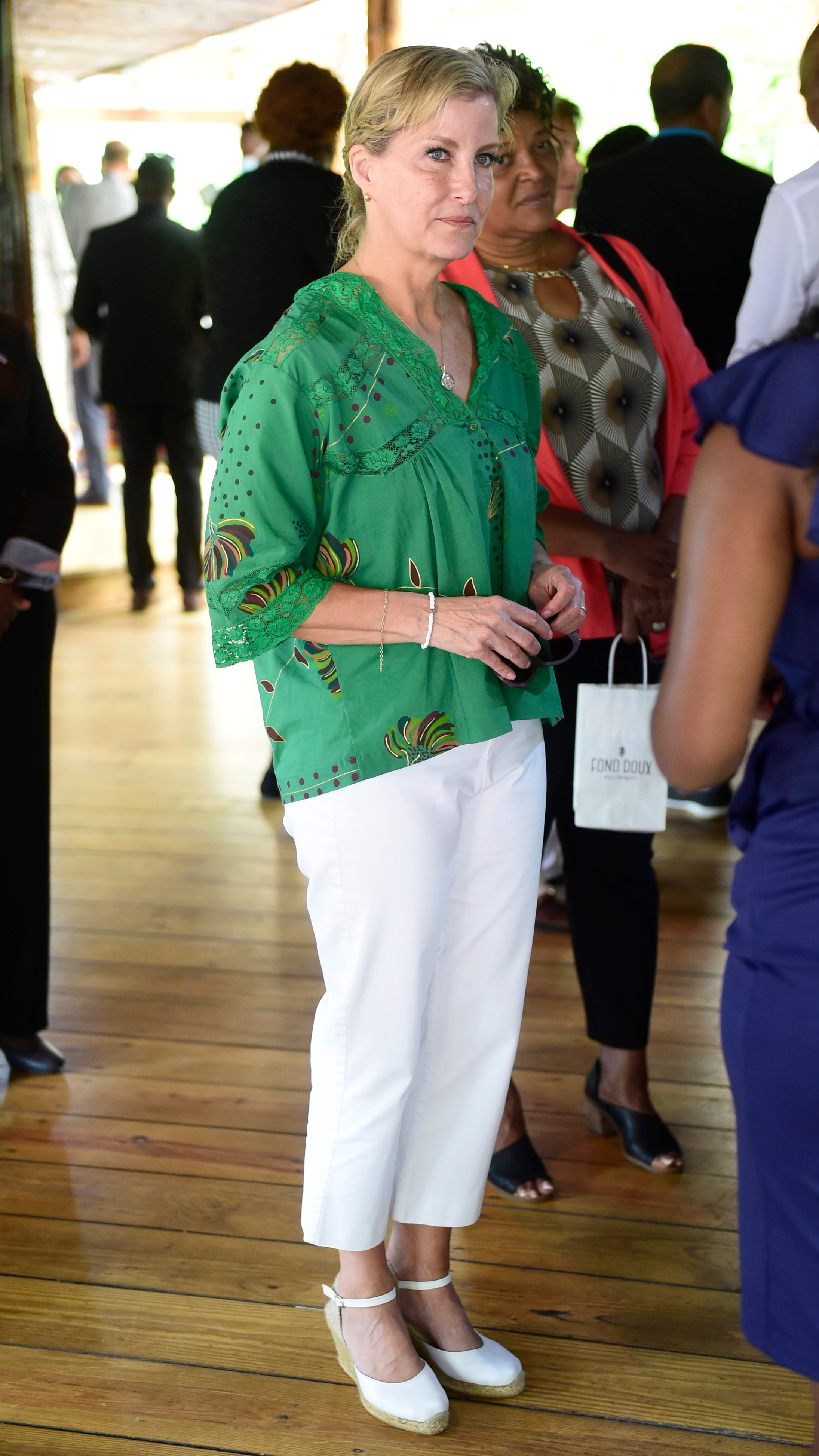 Sophie, Duchess of Edinburgh speaks with staff members during a visit to Fond Doux Cocoa Plantation on day six of the Platinum Jubilee Royal Tour of the Caribbean on April 27, 2022