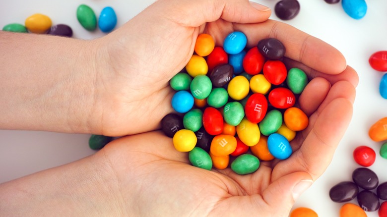 M&M's candy in woman hands