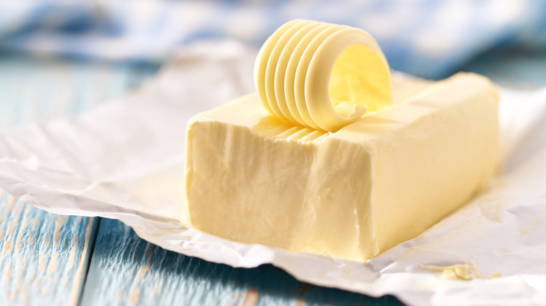 A block of butter with a curl on top