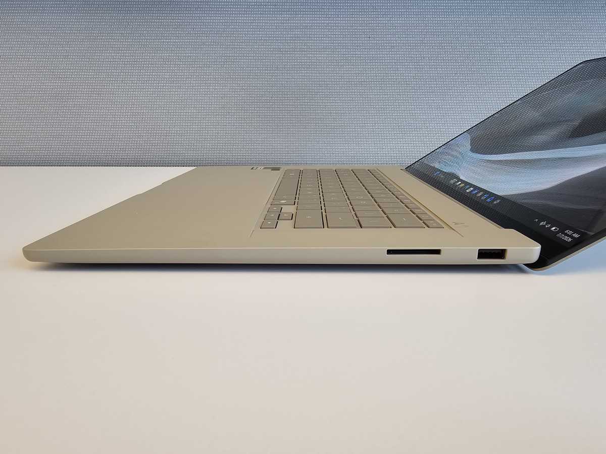 The ZenBook A16’s screen at full recline, with an SD card slot as well as a generic USB-A port.