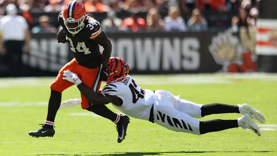 Jerome Ford runs through a tackle attempt.