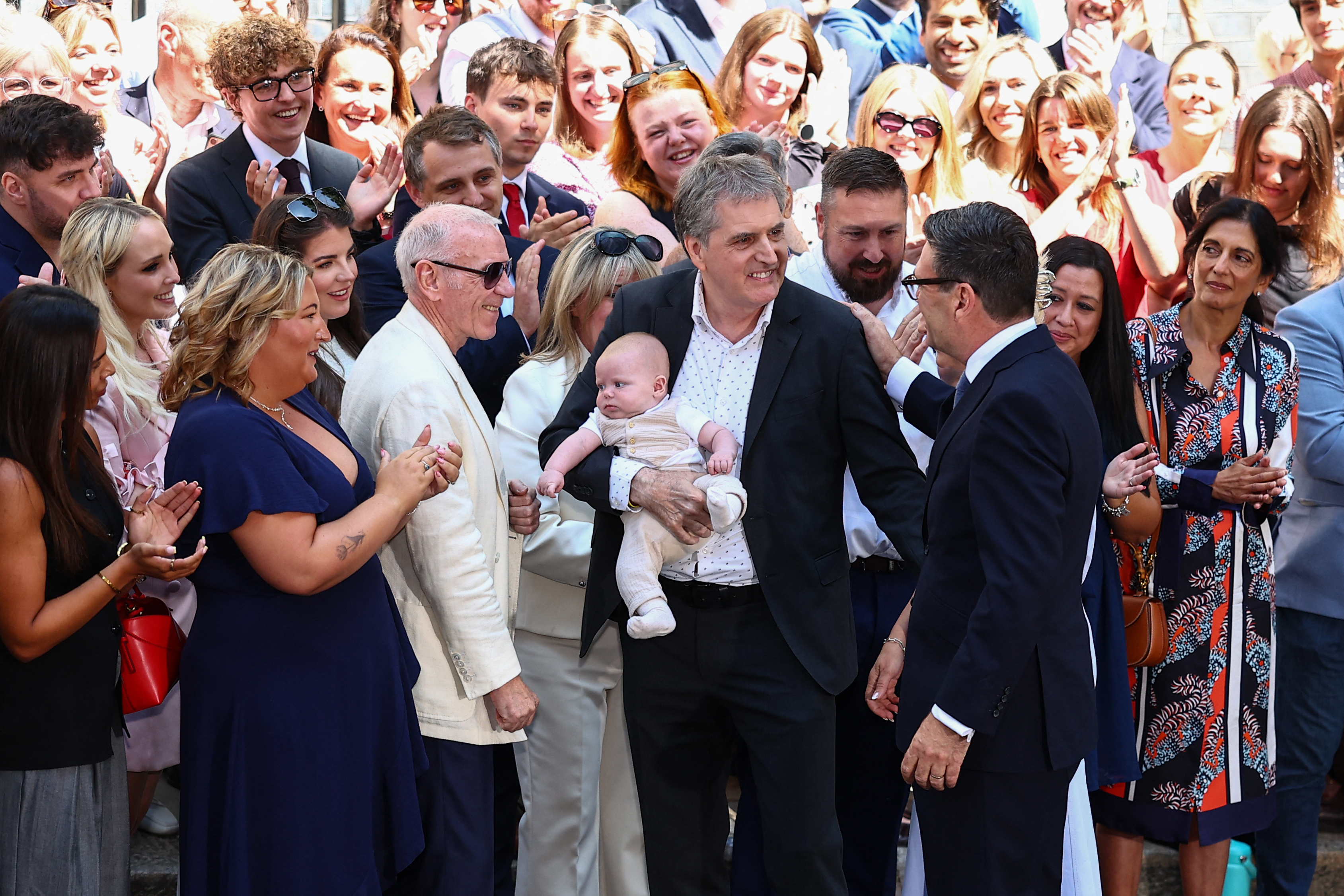 Britain's new Prime Minister Andy Burnham is greeted by Liverpool Mayor Steve Rotheram before giving his first speech in front of 10 Downing Street (AFP/Getty)