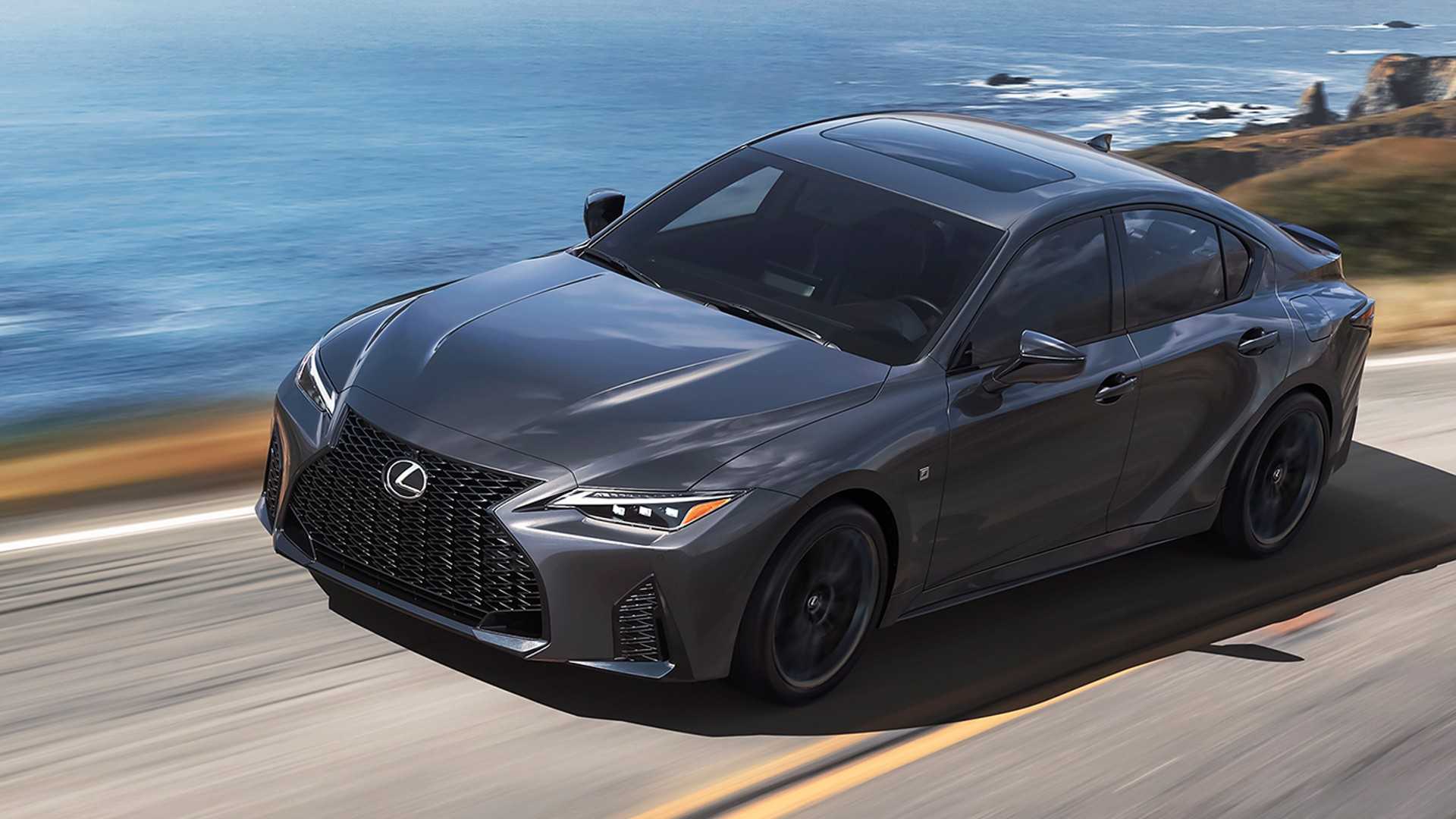 Gray 2024 Lexus IS500 F Sport front 3/4 shot driving on the road