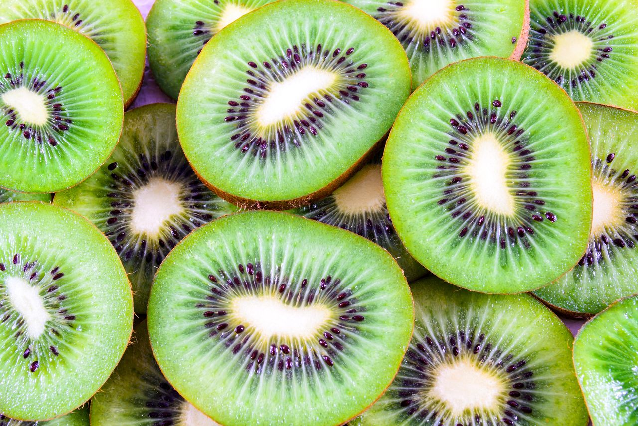 Stack of sliced kiwi fruits showing their interior texture