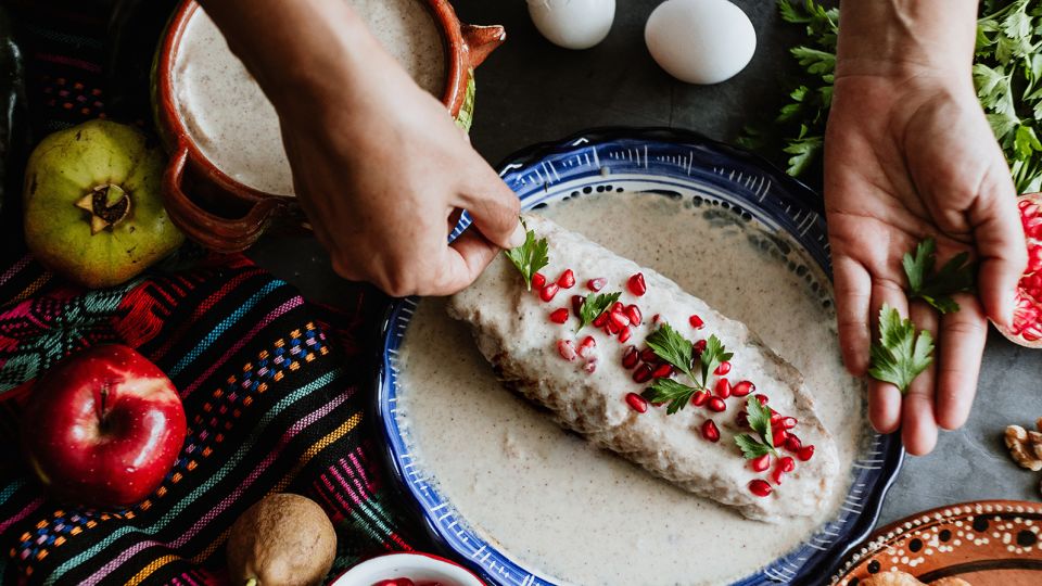 This colorful stuffed pepper dish is associated with Mexican Independence Day. - Marcos/Adobe Stock
