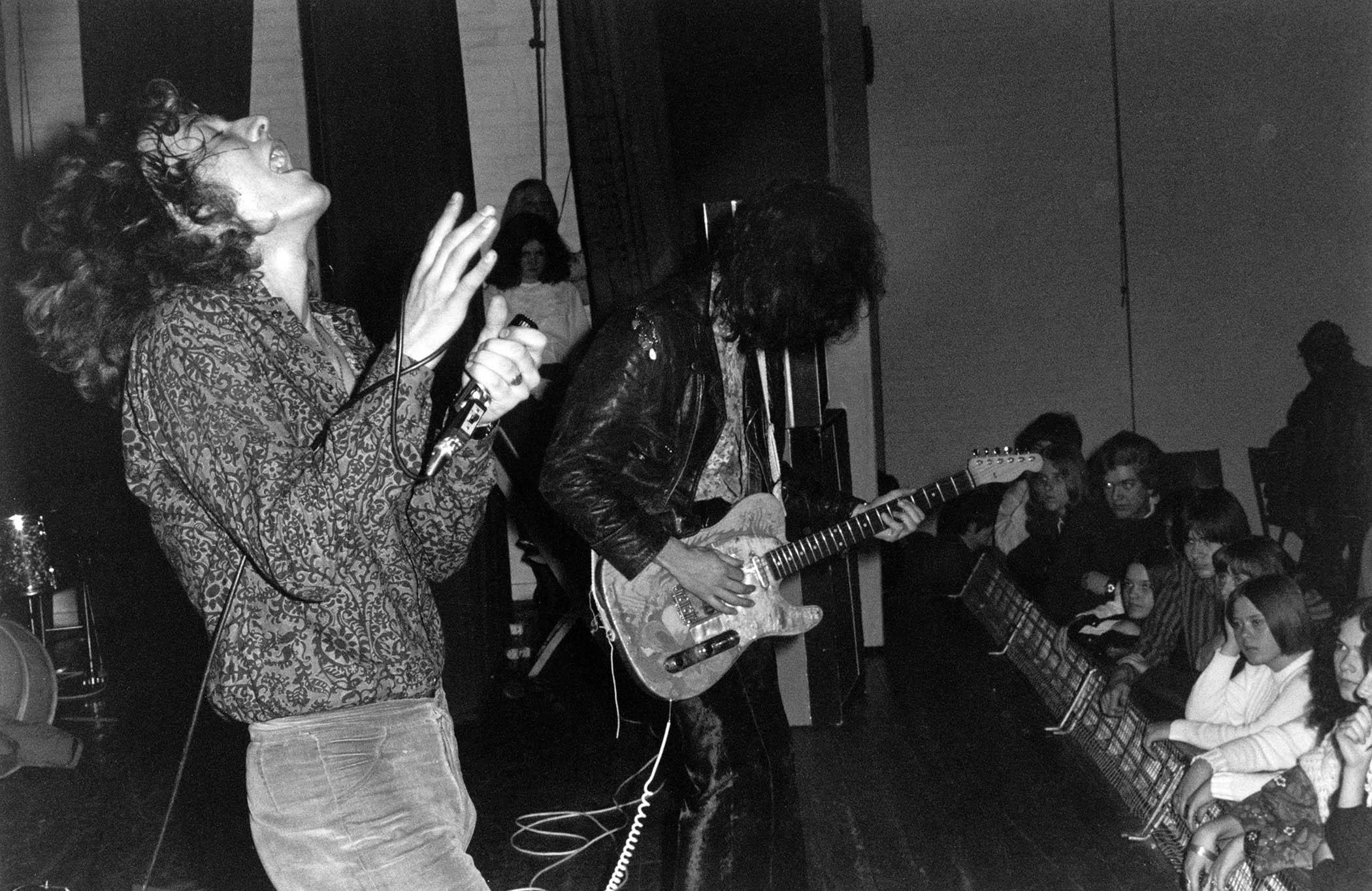 Led Zeppelin's Robert Plant and Jimmy Page perform onstage – Page's Telecaster has been refinished with his Dragon artwork.